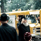 The Rebbe watching Mitzvah Tanks roll past in Crown Heights